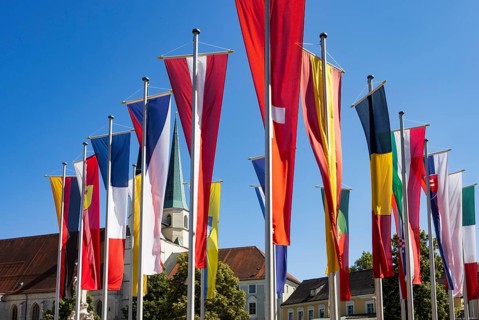 National flags at Kapellplatz with the collegiate parish church of St Philip and St James, place of