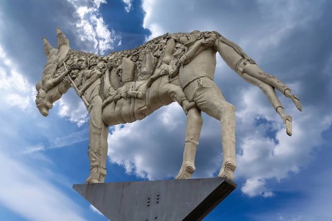 Monument: The trial of the donkey's shadow, created by the artist Peter Lenk, market square,