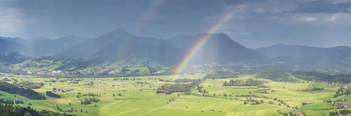 Panorama from Grünten over the Illertal with rainbow to Blaichach and Immenstadt, behind