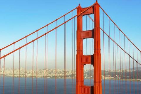 View of Golden Gate Bridge and financial district in the distance, San Francisco, California, USA
