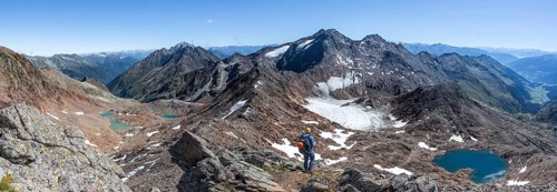 Mountain panorama, mountaineer in rocky high mountain landscape at the Rotgratscharte, view of