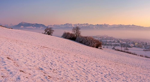 Village in the fog and in the light of dusk, behind the Rigi, Hohenrain, Seetal, Canton Lucerne,