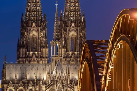 Cologne Cathedral and the Hohenzollern Bridge illuminated with LED lights, Cologne, North
