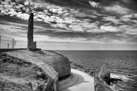 Pointe du Hoc, memorial on former German bunker, memorial for US Ranger, black and white,