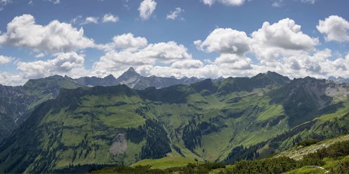 Mountain panorama from the Koblat high trail on the Nebelhorn over the Obertal valley with lush