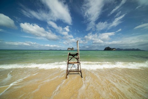 A lonely boarding and disembarking ladder for longtail boats on the beach of Koh Ngai Island,
