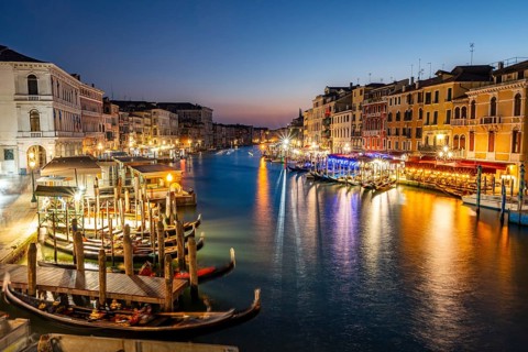 View of the Grand Canal at the blue hour, picturesque evening mood with illuminated palazzos on the