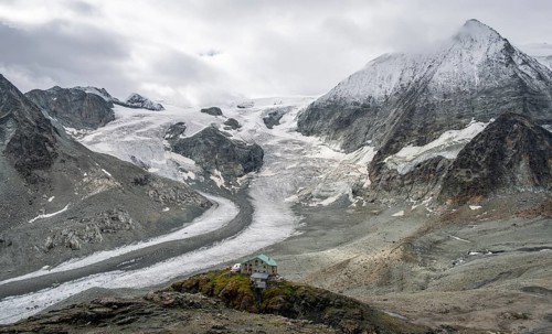Mountain hut Cabane des Dix in front of glacier Glacier de Cheilon and summit Mont Blanc de