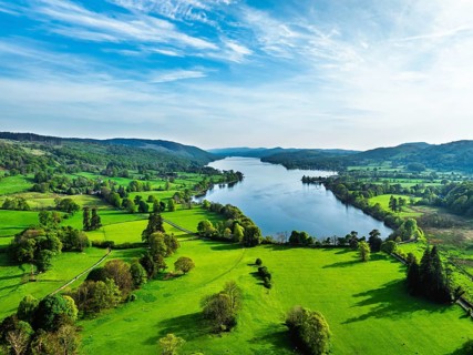 Farms over Coniston Water from drone, Lake District National Park, Cumbria, UK