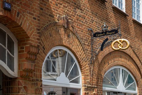 Brick building with bakery and wrought-iron sign, Old Town, Ringkøbing, Ringkøbing Fjord, Denmark
