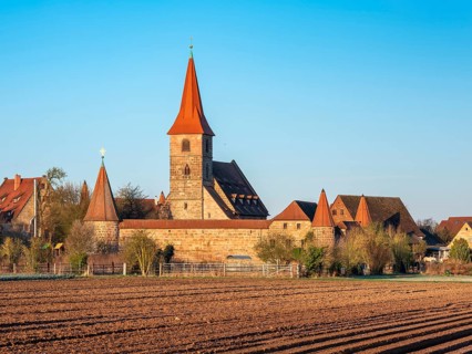 The medieval fortified church of St. George in the district of Kraftshof, Nuremberg, Middle