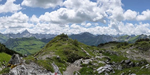 Mountain panorama from the Koblat high trail on the Nebelhorn over the Obertal valley with lush