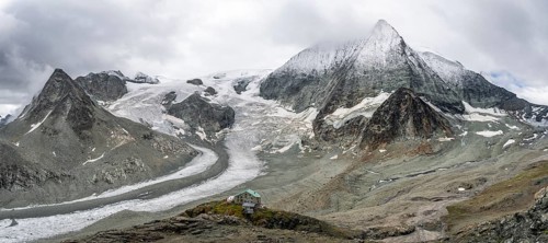 Mountain hut Cabane des Dix in front of glacier Glacier de Cheilon and summit Mont Blanc de
