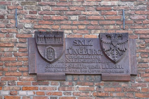 City coat of arms with inscription on the history of the city on the historical trade in salt, by