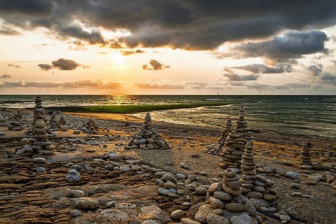 Sunset over beach of WHALE LIGHTHOUSE, Saint-Clement-des-Baleines, Atlantic, France