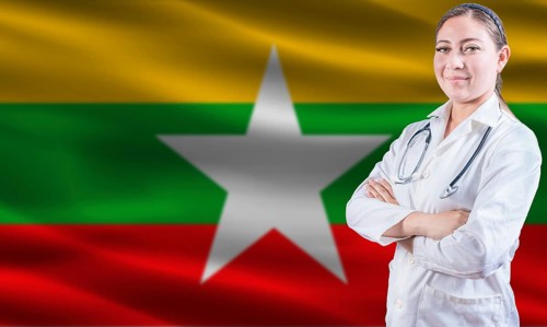 Female doctor on Myanmar flag. Doctor with crossed arms on Myanmar flag. Myanmar health and care
