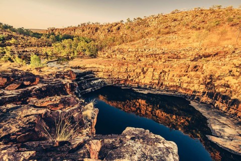 Bell Gorge waterfall, a body of water in north-west Australia in the Kimberley. Sunrise in the