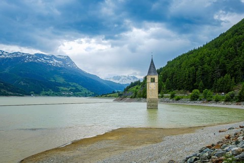 Bell tower of the former parish church of St Catherine in the sunken village of Alt-Graun in Lake