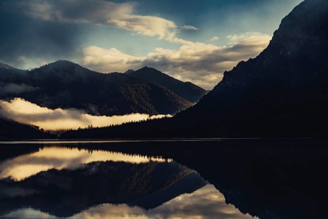 Sunrise with reflections in the Plansee in Tyrol in the Alps in Austria