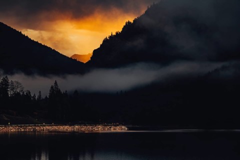 Surreal light atmosphere at sunrise at Plansee, Tyrol, in the Alps in Austria