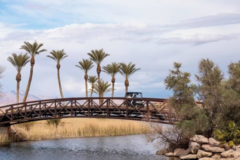 Golf cart crossing a golf cart bridge over an inlet of the Las Vegas Wash at Lake Las Vegas in