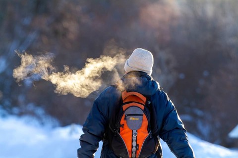 Person walking in very cold weather, Visual effect of the steam seen when exhaling in cold weather.