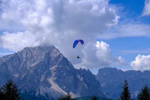 Paragliders over the Sesto sundial on the Helm, Sesto, Dolomites, Val Pusteria, South Tyrol, Italy