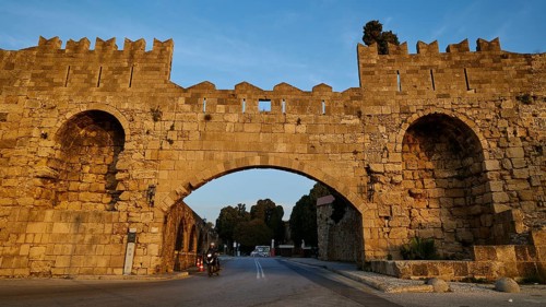 Arsenal gate, Rhodes city wall, Historic stone city gate in evening light, Harbour area, Rhodes