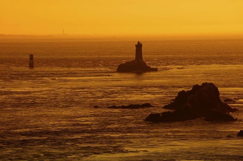 Phare de la Vieille lighthouse at sunset, Pointe du Raz, Cap Sizun, Finistere department, Brittany,