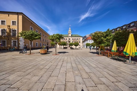 Square, historic town hall, trees, general architecture, outdoor area of a restaurant with
