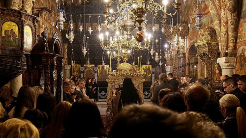 Full church with richly decorated interior and candlelight during a celebration, Epitaphio, Holy