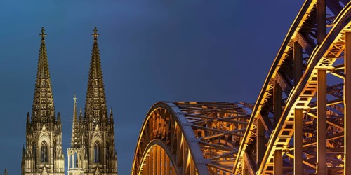 Cologne Cathedral and the Hohenzollern Bridge illuminated with LED lights, Cologne, North