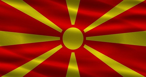 North Macedonia flag with fabric texture. Realistic flag of North Macedonia waving