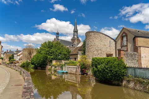 Moat in Bonneval with the church of Notre-Dame, Centre-Val de Loire, France