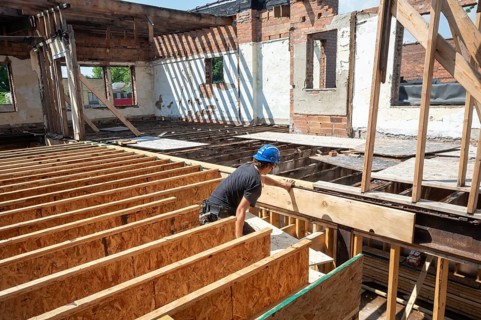 Detroit, Michigan - Austin Barr helps rehab a long-vacant and crumbling commercial building in the