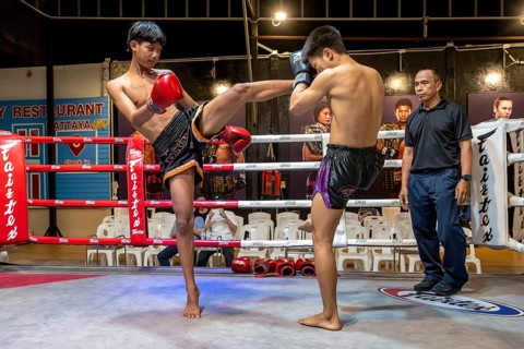 Thai boxing Muai Thai boxer in action, Pattaya, Thailand