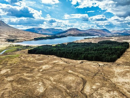 Mountains and Moors over Loch Tulla and River Orchy from a drone, Highlands, Scotland, UK