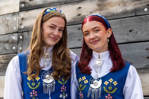 Young woman in traditional traditional costume at the reception for King Harald at the end of coal