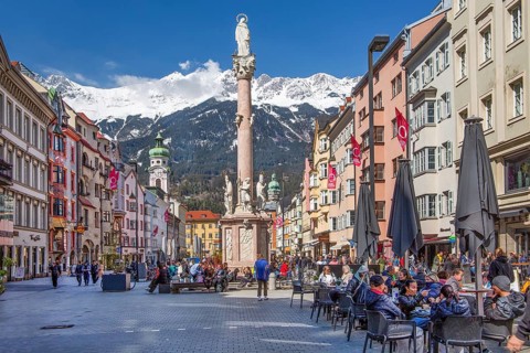 Pedestrian zone Maria-Theresien-Strasse with the Annasäule in front of the Nordkette of the