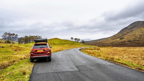 Off road 4x4 car with tent roof on Isle of Sky, Scotland, UK
