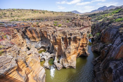 Canyon with steep orange-coloured cliffs with the Blyde River, Bourke's Luck Potholes, Panorama