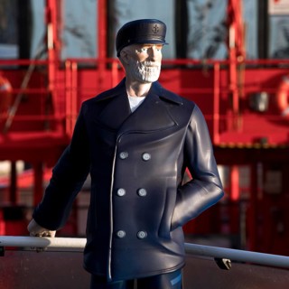 3-D figure of the captain permanently installed on the bow of the harbour ferry of line 62 in front