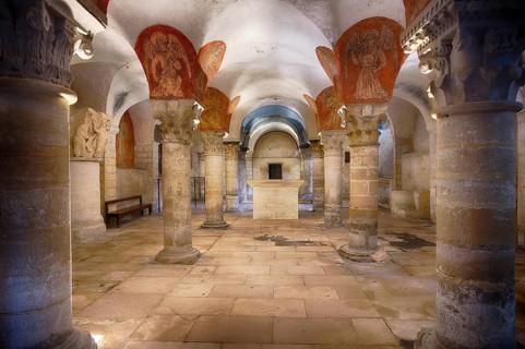 Interior, ochre-coloured drawings of angels playing music, ancient Roman crypt, Cathédrale