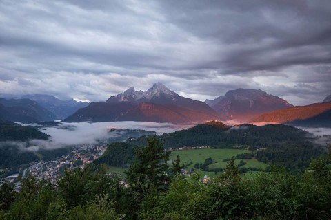 Marxenhöhe near Berchtesgaden with Watzmann view in the morning mist and alpenglow after the rain