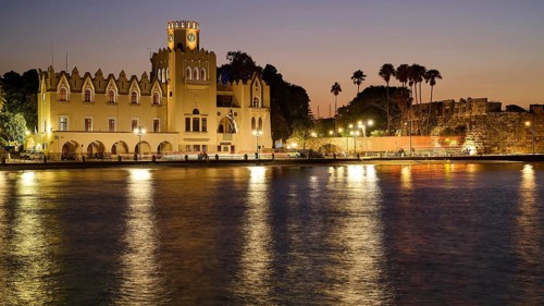 Palace of Justice, Colonial building, Historic building at night with lights and palm trees,