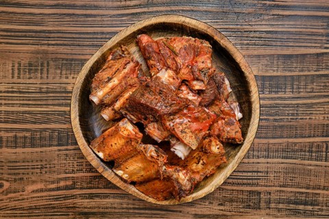 Tender short beef ribs are perfectly roasted in the oven, showcasing a rich, savory flavor. The