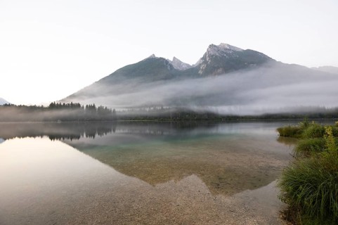 Magical sunrise with fog at Hintersee near Ramsau in Berchtesgadener Land