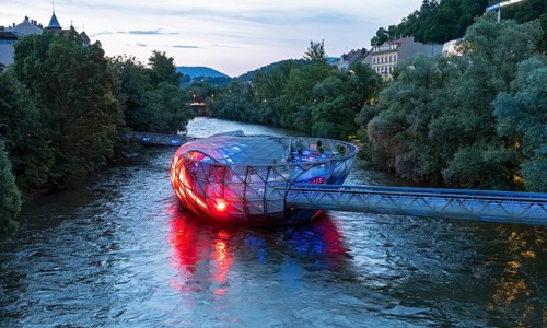 Murinsel floating island on the river Mur by night, Graz, Austria