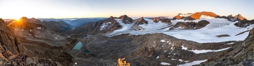 Panorama at sunrise with alpenglow, high mountain landscape, view of blue glacial lakes, mountain