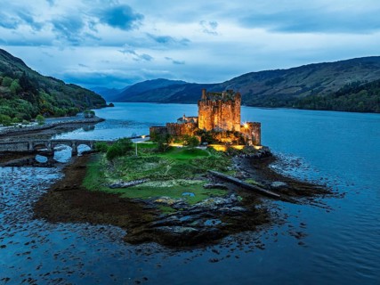 Night over Eilean Donan Castle and Loch Duich from a drone, Isle of Skye, Highlands, Scotland,